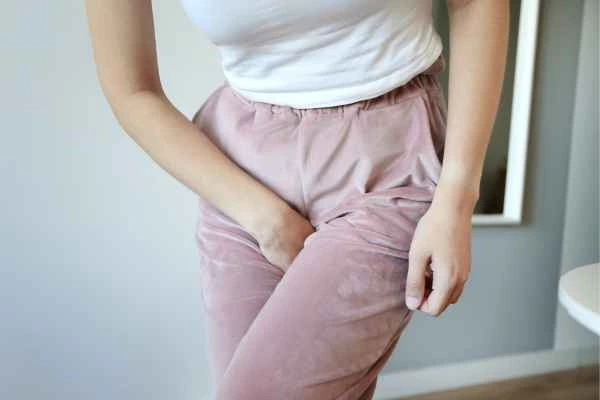 older woman running to the toilet because of urinary incontinence Greater London (Hammersmith and Fulham)